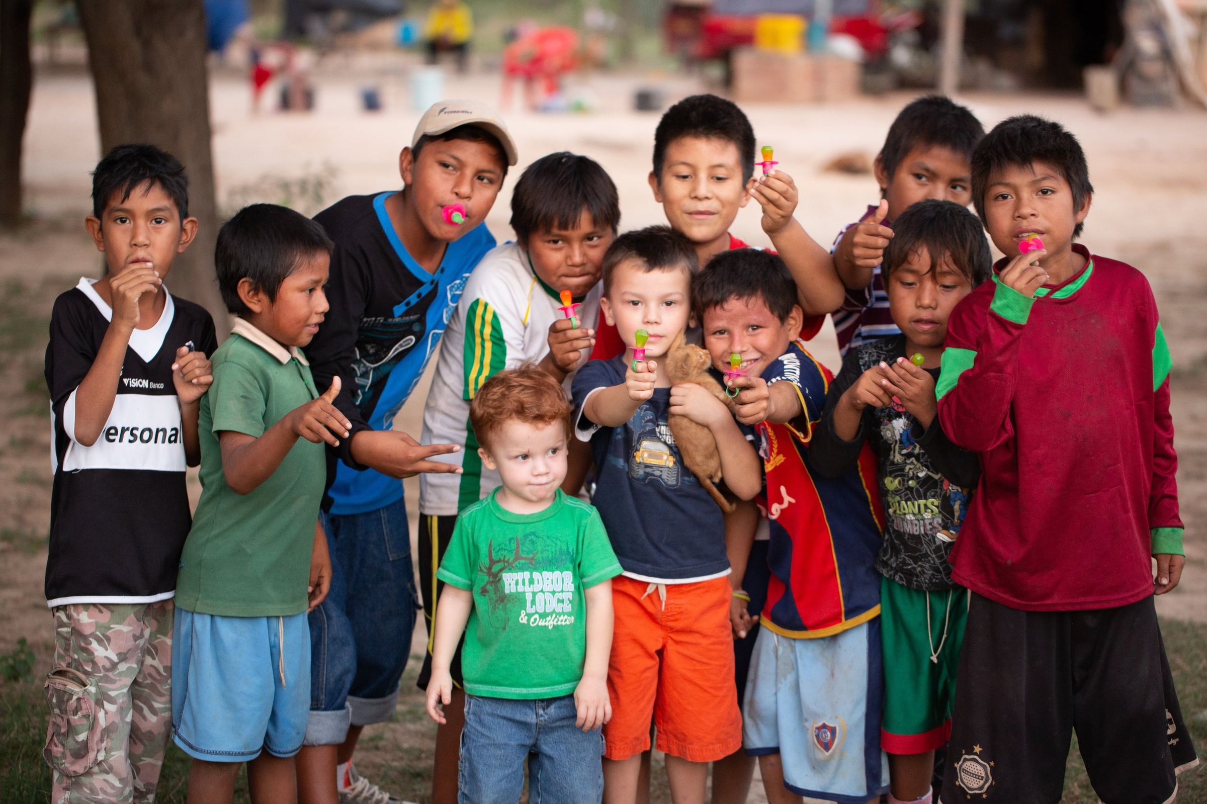 Children from the Nivacle community in Paraguay holding Ring Pops