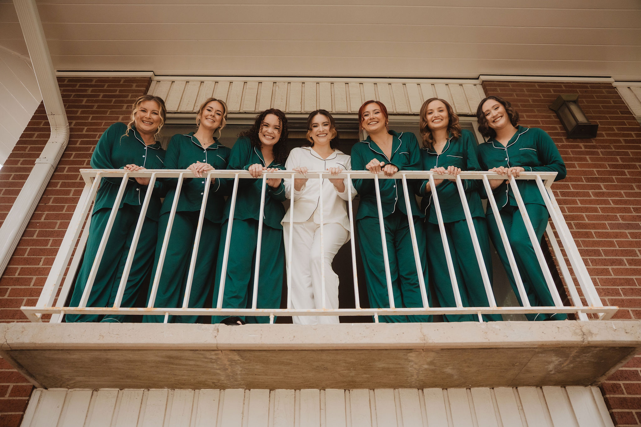 Brittney with bridesmaids in emerald dresses