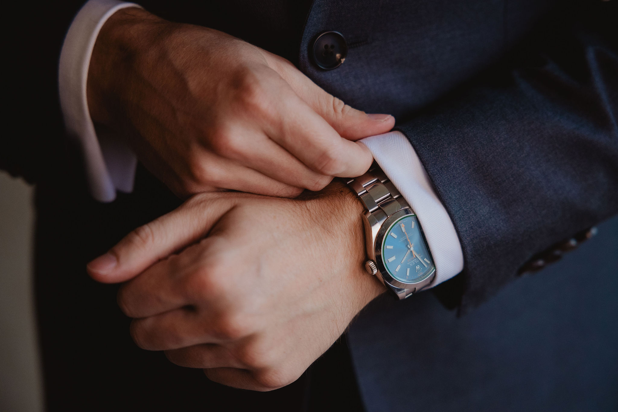 Trevor adjusting his watch before the wedding