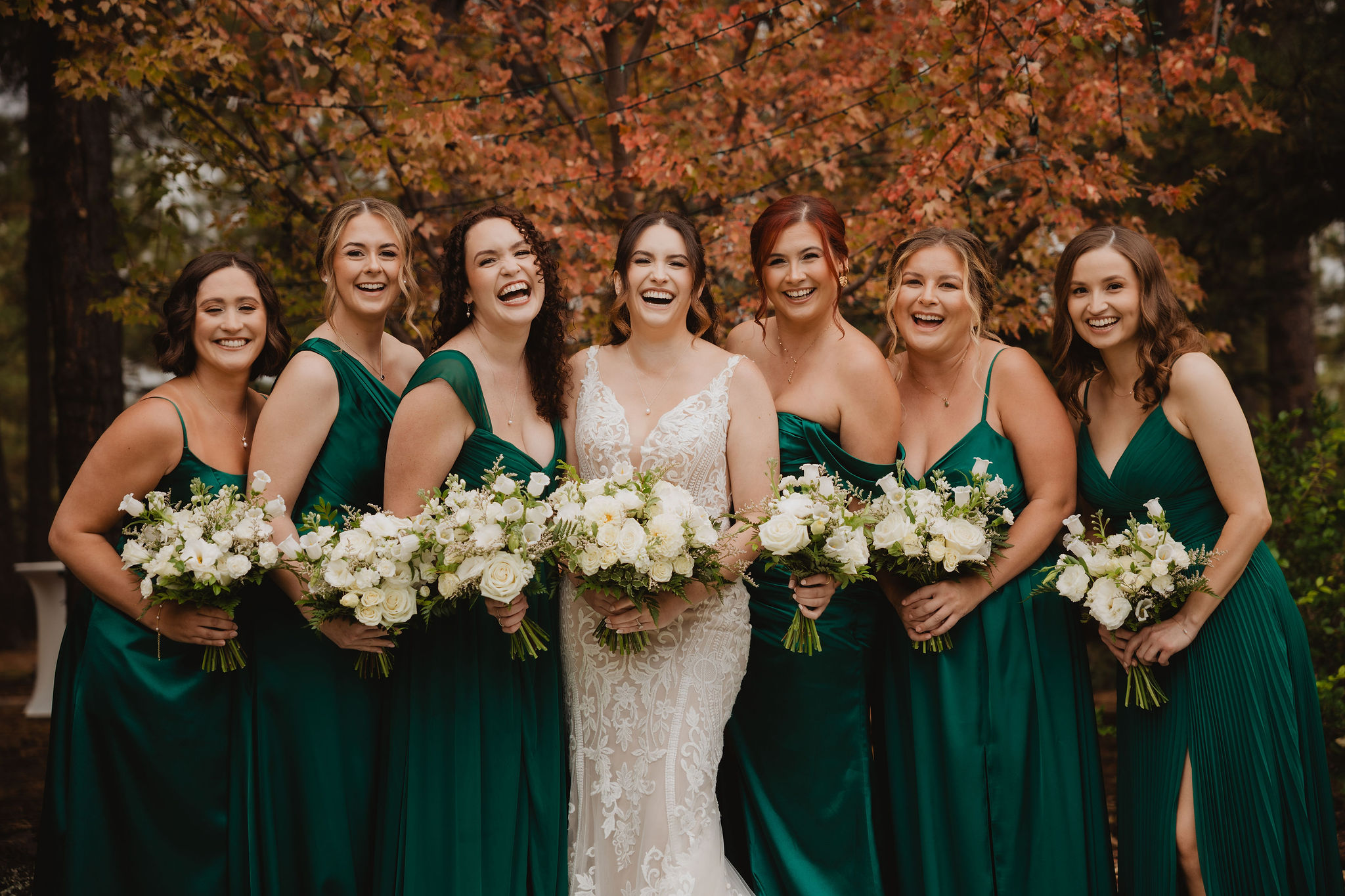 Brittney and her bridesmaids laughing together