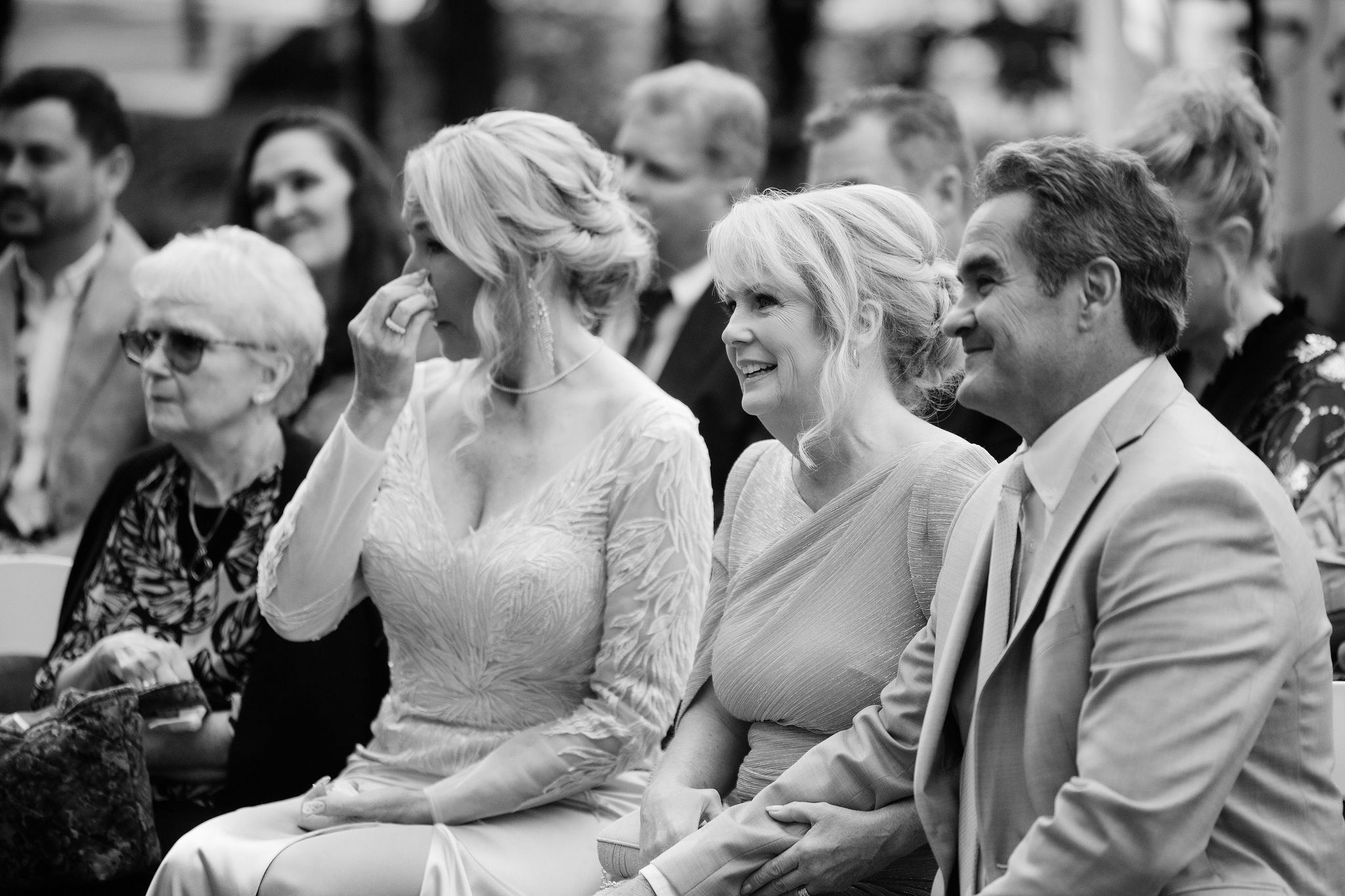 Guests smiling during the ceremony