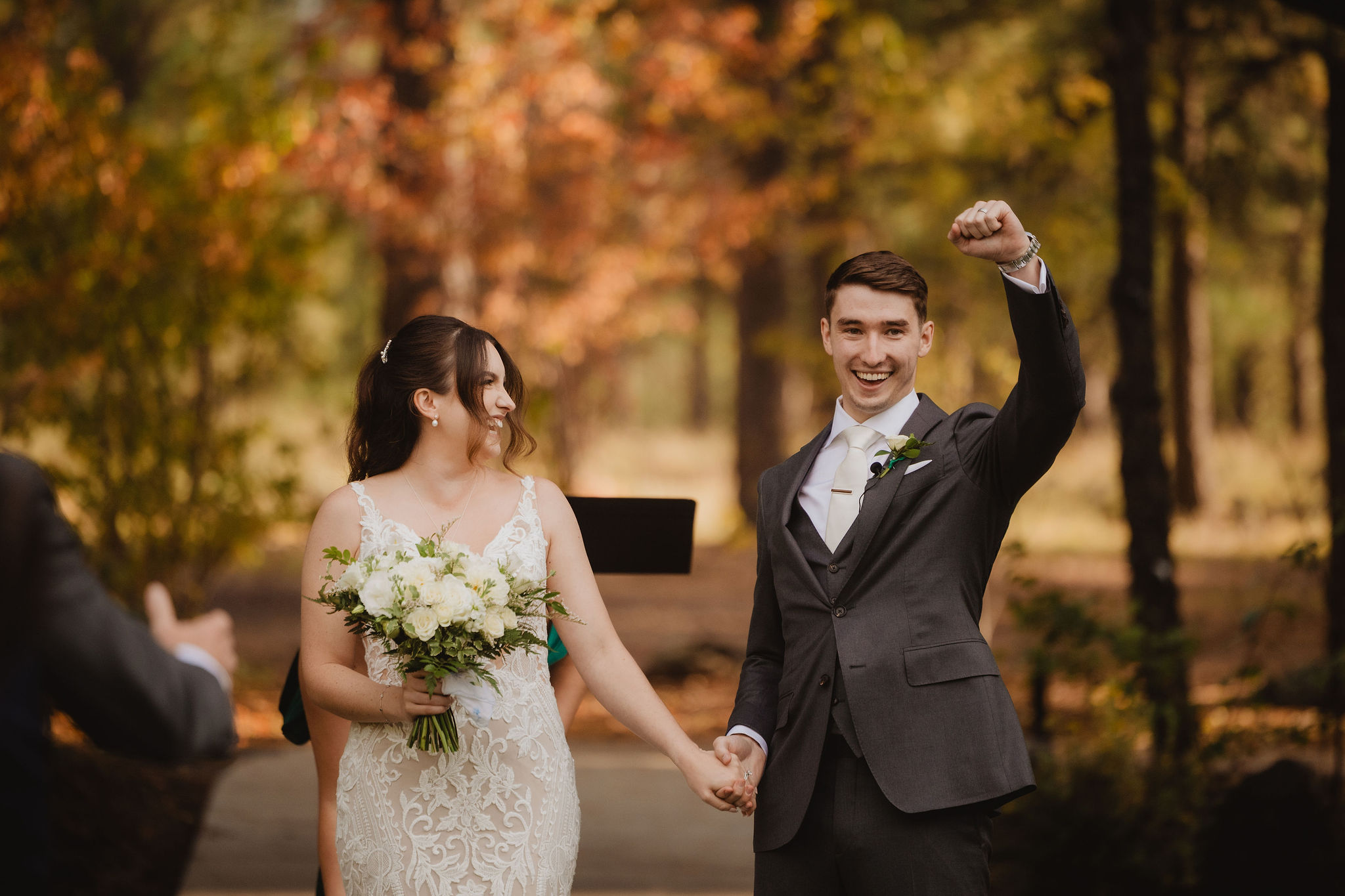 Brittney and Trevor walking after the ceremony