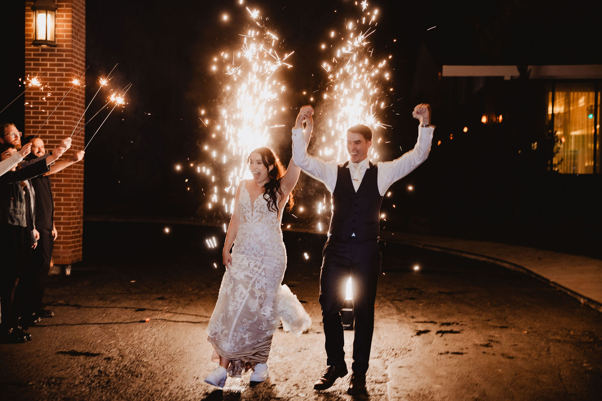 Brittney and Trevor with cold sparks at their wedding exit